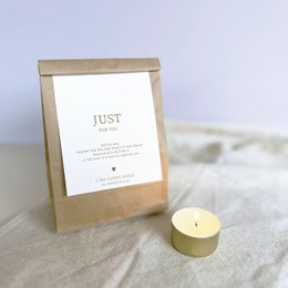 White bath bombs with floral design and "With Love" text on packaging.