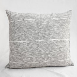 A gray and white striped cushion cover with a textured, woven pattern.