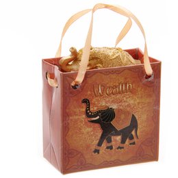 Elefante de la suerte con purpurina metálica en una mini bolsa de regalo