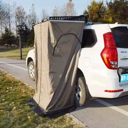 Portable vehicle-mounted shower toilet tent, beige canvas, self-standing cabin, outdoor camping shelter.