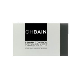  A black and white facial mask product with the title "Sébum Control - soin au Charbon actif" indicating it is a charcoal-based face mask for sebum control.