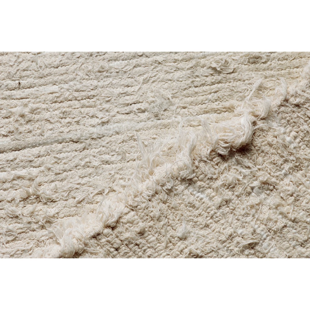 Klein crèmekleurig katoenen vloerkleed van 100/50 cm