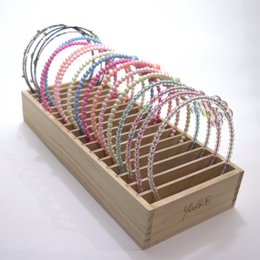 YUKO B HEADBAND OFFER. Wooden display including the entire collection of headbands, 2 per model and 34 in total