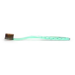 Green toothbrush with gold and charcoal bristles for oral care.
