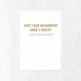 "Greeting card with text 'Hope your neighbors aren't creepy' and a pink flower in the background."

The image shows a greeting card with the text "Hope your neighbors aren't creepy" printed on it. The card has a simple, minimalist design with a gold-colored envelope. In the background, there is a pink flower, likely a peony or similar, adding a touch of natural beauty to the scene.