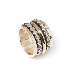A gold and diamond wedding ring set with multiple bands featuring round brilliant cut diamonds in a variety of sizes and settings.