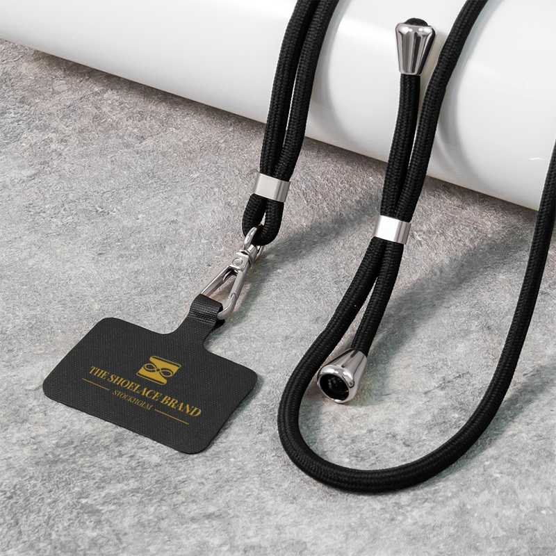 Universalt mobilband i svart och silver
