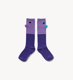 Violet-colored kids' socks with pom-pom details.