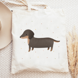 Dachshund-themed tote bag, made of natural jute material, featuring a simple black silhouette of a dachshund dog against a white background.