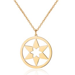 A gold-toned necklace with a circular pendant featuring a star design. The necklace is made of a durable metal alloy and comes in a variety of color options.