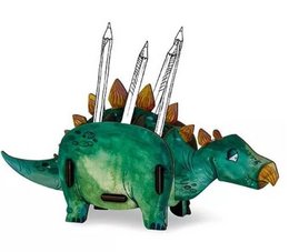 A green dinosaur-shaped pen box with three pencils sticking out of the top. The box has a stegosaurus-like appearance with spikes along the back.