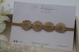  Floral hairband in gold color, featuring a row of sunflower-shaped decorative elements, suitable for children.