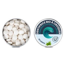 Solid chewable mint-flavored toothpaste in a tin container.