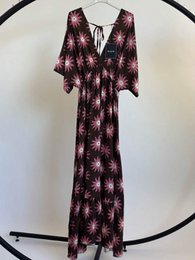 Floral print maxi dress, short sleeves, burgundy and coral colors, bohemian style.