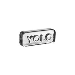 A rectangular glass paperweight with the text "YOLO" printed on it. The paperweight has a simple, minimalist design and appears to be made of clear glass.