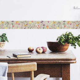 "Self-adhesive border 'Botanical Garden' with multicolored and green-beige floral patterns. Suitable for use as wallpaper in home decor."
The self-adhesive border "Botanical Garden" features a multicolored and green-beige floral pattern. The design includes various flowers such as daisies, lilies, and other botanical elements. This border would be suitable for use as wallpaper in home decor, adding a nature-inspired and vibrant touch to any room.