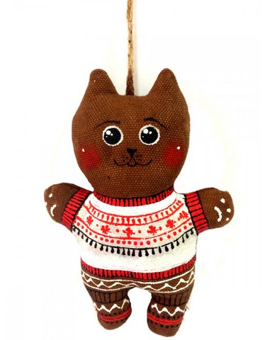 Kitty in een trui met sneeuwvlokken