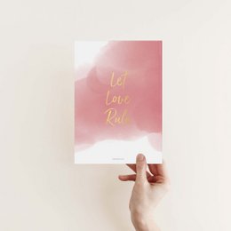 A5 poster with gold foil text "Let love rule" on a pink watercolor background.