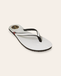 White leather flip flops with a simple, minimalist design. Features include a cotton lining, micro 7mm sole, and a comfortable fit.