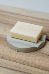 Rectangular limestone soap dish with a smooth, natural surface texture.