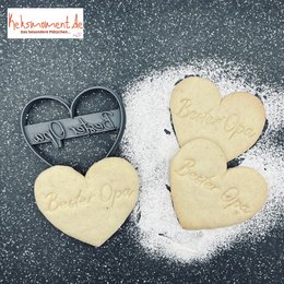 Heart-shaped cookie cutter with "Best Grandpa" text, used for baking decorations.