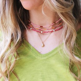 Delicate necklace with a pink flower