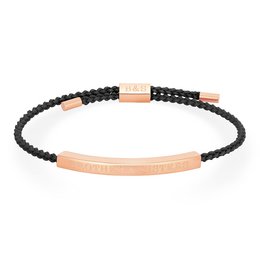 A black woven bracelet with a rose gold metal bar accent.