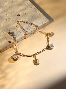 Busy shell bracelet, sea star and pearl