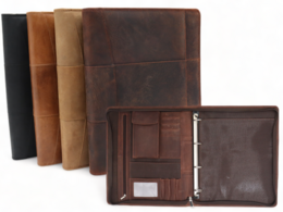 A leather writing case in various colors, including black, brown, and tan. The case features an A4 size, a conference folder, a document folder, a tablet sleeve, and a laptop sleeve. It also has a removable ring binder.