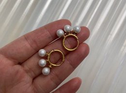Kiril - Triple Pearl Row Gold Huggie Earrings