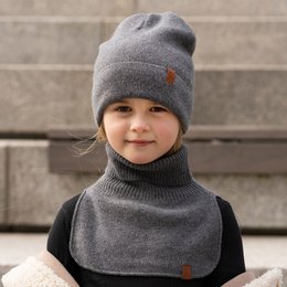 Warm knitted merino and cashmere neck warmer for kids in dark gray, light blue, dusty pink, and creamy beige colors. Available in sizes 0-3 years and 3-10 years.