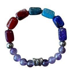 Colorful beaded bracelet with rainbow-colored stones and a butterfly bead.