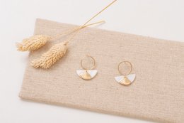 Gold-toned drop earrings with a half-moon shape and textured finish.
