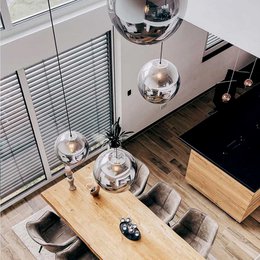 Glass ball pendant lamp with clear or colored glass shades in various sizes from 20cm to 50cm diameter. Available in black, gold, chrome, and smoke color finishes.
