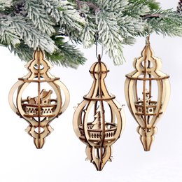 Wooden laser-cut ornaments, teardrop and round shapes, natural wood color, intricate treehouse design, Christmas decorations.