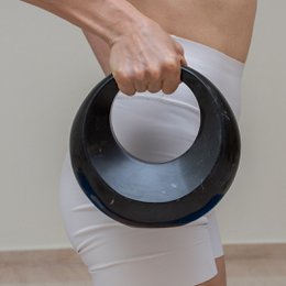 Small black marble kettlebell for fitness training.