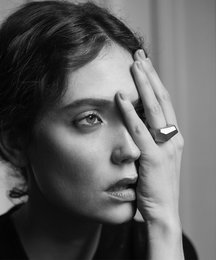 Geometric gold-toned statement ring with a unique faceted design.