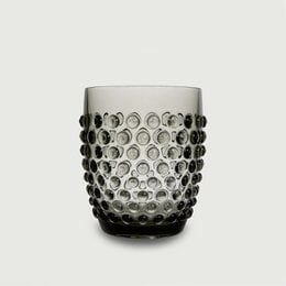 Acrylic drinking cup with a dotted, textured design in a gray color. Durable, lightweight, and unbreakable, making it ideal for use in the garden, on picnics, or for a playful look.