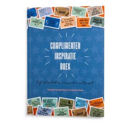 A blue book cover with the title "Compliments Inspiration Book" surrounded by various colorful stickers or labels. The book appears to be a collection of inspirational or motivational content.