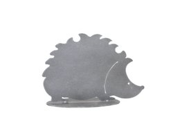  A decorative metal hedgehog figurine on a plate. The hedgehog has a simple, minimalist design with a gray color. This decorative piece would make a charming addition to a shelf or tabletop.