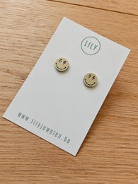  Silver stud earrings with a smiley face design. Circular shape, metal material.