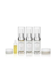 Rose Renew Discovery Set - A set of moisturizing creams and serums in a minimalist, white packaging design. Includes ingredients like rose extract to nourish and renew skin.
