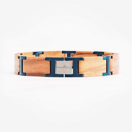 A wooden bracelet with a fig tree design, featuring a combination of natural wood and navy blue accents in a stylish, geometric pattern.