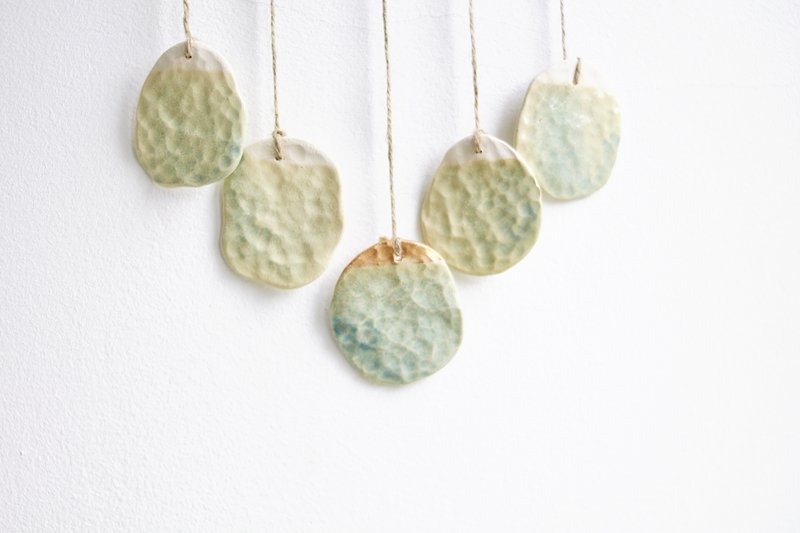 Bohemian wall hanger made of ceramic