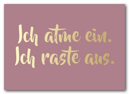 A pink postcard with the text "Ich atme ein. Ich raste aus." in a cursive yellow font.