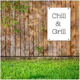 Chill & Grill - Black garden poster with text on a wooden fence background and green grass in the foreground.