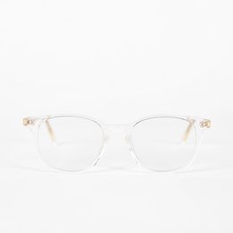 Transparent acetate frame glasses with a subtle cat-eye shape and gold accents. Designed to block blue light from digital screens.