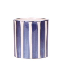  A round, blue and white striped ceramic plant pot with a white orchid plant inside.