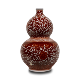 vaso di zucca con fiori della famiglia rosa