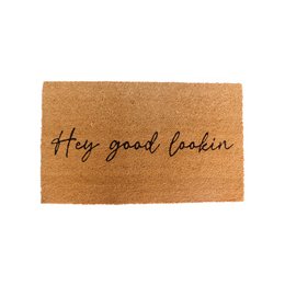 A rectangular doormat made of natural coir fiber with the text "Hey good lookin" printed in black cursive font. The doormat has a warm, earthy tone and a simple, casual design.